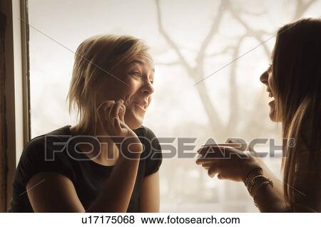 Stock Photo - Two women meet for coffee. Fotosearch