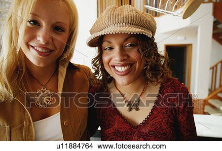 Two women smiling View Large Photo Image Picture - Two women smiling. Fotosearch