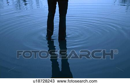 Stock Image - Walking in water. Fotosearch
