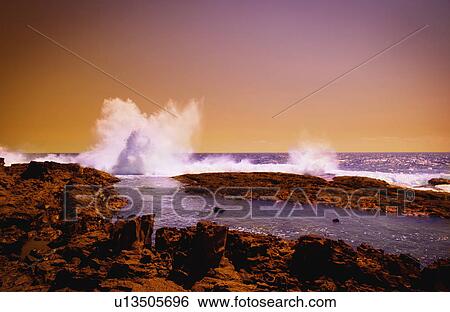 Wave crashing on rocks View Large Photo Image Stock Photograph - Wave crashing on rocks. Fotosearch