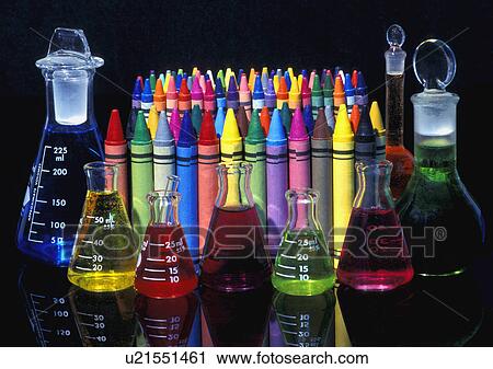 Stock Image - Wax crayons and measuring flasks. Fotosearch