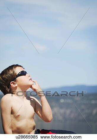 Stock Photography - What keeps the sun up there?. Fotosearch