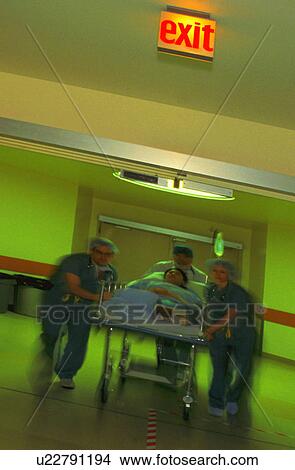 Picture - Wheeling a patient. Fotosearch