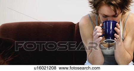 Woman drinking coffee View Large Photo Image Stock Photo - Woman drinking coffee. Fotosearch