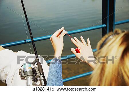 Stock Photography - Woman "fishing". Fotosearch