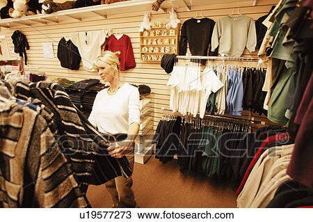 Stock Image - Woman goes shopping. Fotosearch