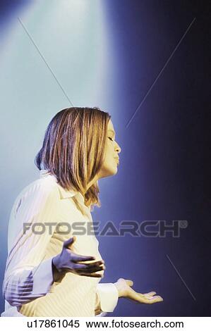 Woman lifts her hands to God View Large Photo Image Stock Photography - Woman lifts her hands to God. Fotosearch