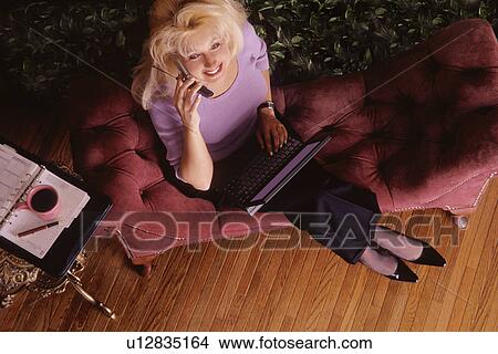Picture - Woman making appointment. Fotosearch