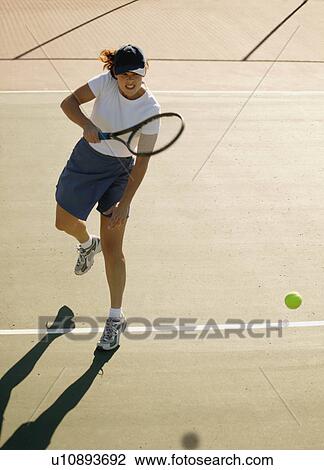 Woman plays tennis View Large Photo Image Stock Image - Woman plays tennis. Fotosearch