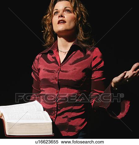 Stock Photography - Woman reading the Bible. Fotosearch