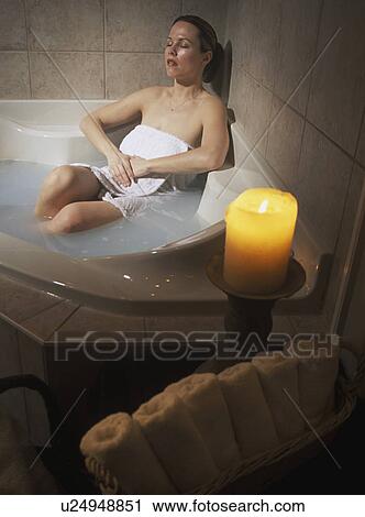 Woman relaxing in hot tub View Large Photo Image Stock Image - Woman relaxing in hot tub. Fotosearch