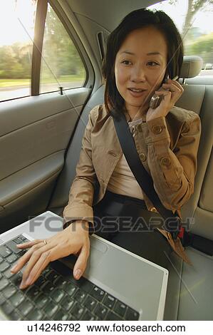 Woman talks on cell phone View Large Photo Image Stock Image - Woman talks on cell phone. Fotosearch