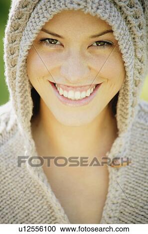 Woman wearing a knit hood View Large Photo Image Stock Image - Woman wearing a knit hood. Fotosearch
