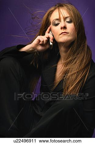 Stock Image - woman with eyes closed. Fotosearch