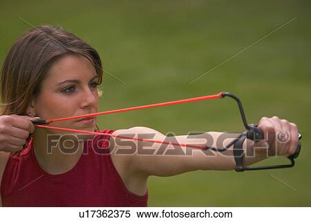 Woman with slingshot View Large Photo Image Stock Photography - Woman with slingshot. Fotosearch