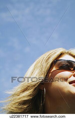 Stock Photo - Woman with sunglasses. Fotosearch