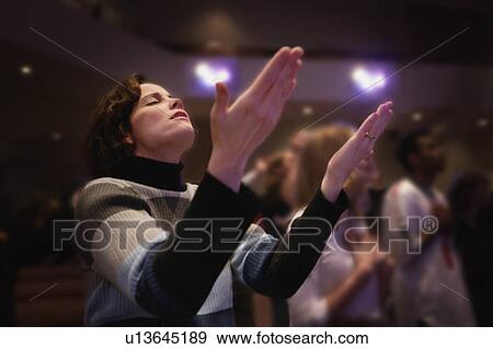 Woman with upraised hands View Large Photo Image Stock Photo - Woman with upraised hands. Fotosearch