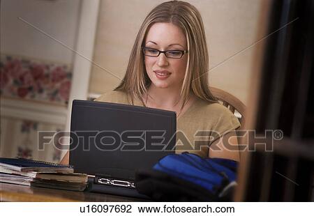 Woman working on lap top View Large Photo Image Stock Image - Woman working on lap top. Fotosearch