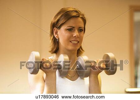 Stock Photograph - Woman working out. Fotosearch