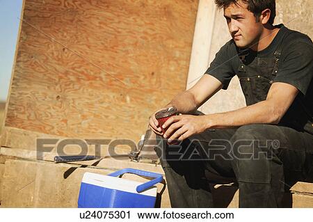 Stock Image - Worker taking a break. Fotosearch