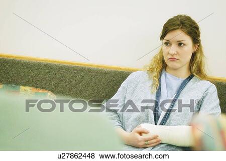 Stock Photo - Worried in the waiting room. Fotosearch