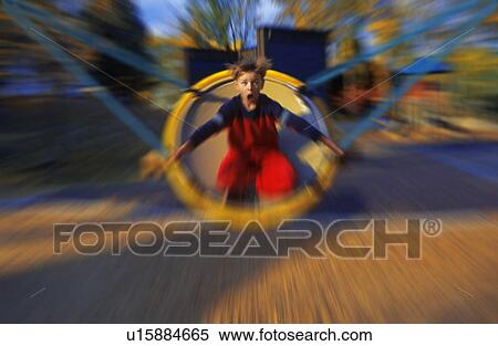 Young boy on playground ride View Large Photo Image Stock Photography - Young boy on playground ride. Fotosearch