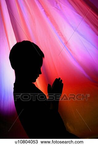 Young boy praying View Large Photo Image Stock Image - Young boy praying. Fotosearch