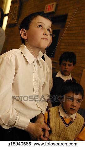 Stock Photography - Young boy praying. Fotosearch