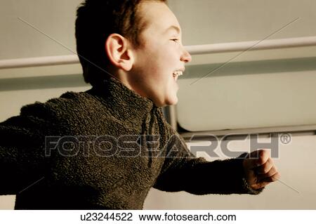 Young boy running View Large Photo Image Stock Image - Young boy running. Fotosearch