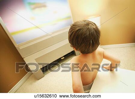 Young child watching TV View Large Photo Image Stock Image - Young child watching TV. Fotosearch