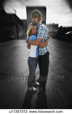 Stock Image - Young couple hugging. Fotosearch