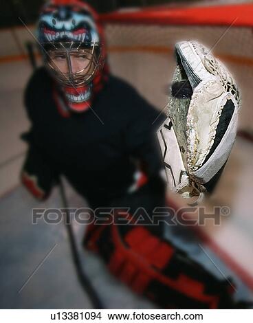 Young goalie in net with glove extended View Large Photo Image Picture - Young goalie in net with glove extended. Fotosearch
