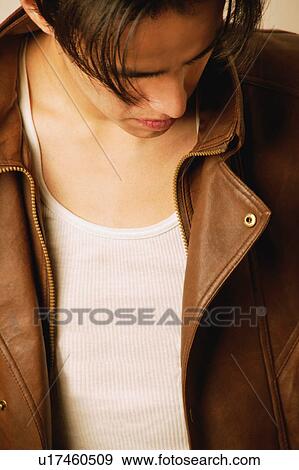 Stock Photo - Young man in brown leather jacket. Fotosearch