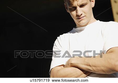 Stock Photo - Young man wearing t-shirt. Fotosearch