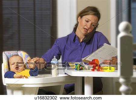 Young mother working from home View Large Photo Image Stock Image - Young mother working from home. Fotosearch