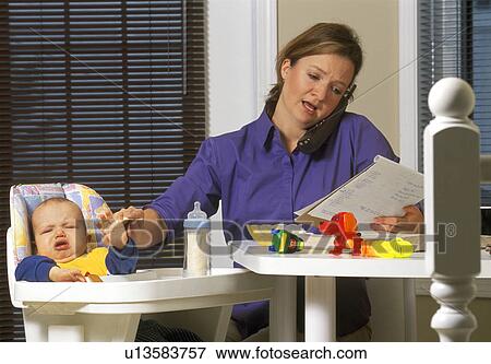 Young mother working from home View Large Photo Image Stock Photo - Young mother working from home. Fotosearch