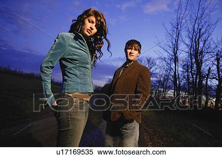 Stock Photography - Young trendy man and woman outside. Fotosearch