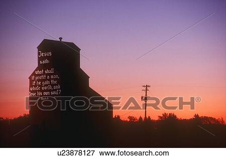 Stock Photo - A biblical message on the side of a grain elevator, Nisku, Alberta, Canada. Fotosearch