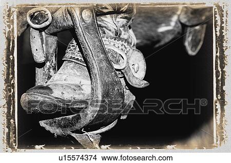 A black and white photo of a cowboy boot and stirrup View Large Photo Image Picture - A black and white photo of a cowboy boot and stirrup. Fotosearch