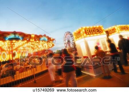 A carousel and ticket booth at an amusement park View Large Photo Image Stock Photo - A carousel and ticket booth at an amusement park. Fotosearch