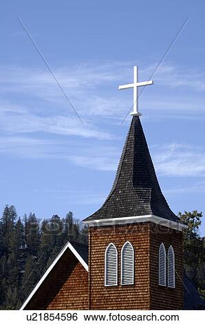 Stock Photograph - A cross on a church spire. Fotosearch