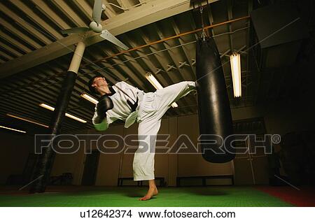 A man practicing Martial Arts View Large Photo Image Picture - A man practicing Martial Arts. Fotosearch