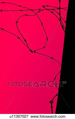 Stock Photo - A mangled barb wire fence. Fotosearch