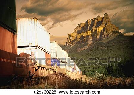 Stock Photo - A train in the mountains. Fotosearch