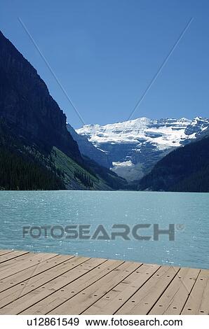 Stock Photo - A view of mountains and a lake. Fotosearch