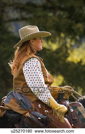 A woman on a horse View Large Photo Image Stock Image - A woman on a horse. Fotosearch