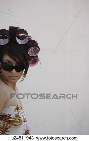A woman with curlers in her hair View Large Photo Image Stock Image - A woman with curlers in her hair. Fotosearch