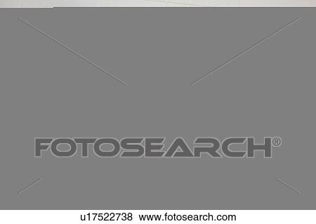 Stock Photo - A woman with curlers in her hair. Fotosearch