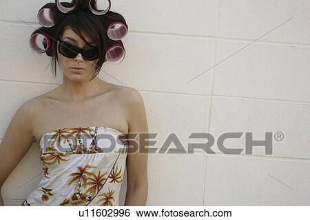 A woman with curlers in her hair View Large Photo Image Stock Photograph - A woman with curlers in her hair. Fotosearch
