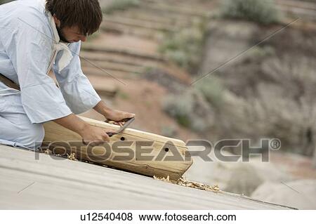 Stock Photo - A young carpenter. Fotosearch